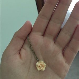 Gold necklace with pink rose
